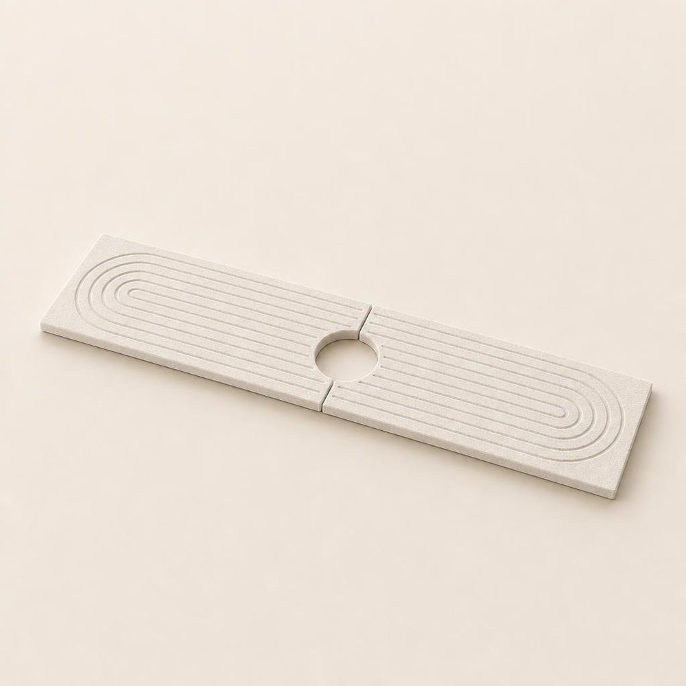 Marbelle diatomite faucet mat, two halves joined with the circular opening for the tap in the middle