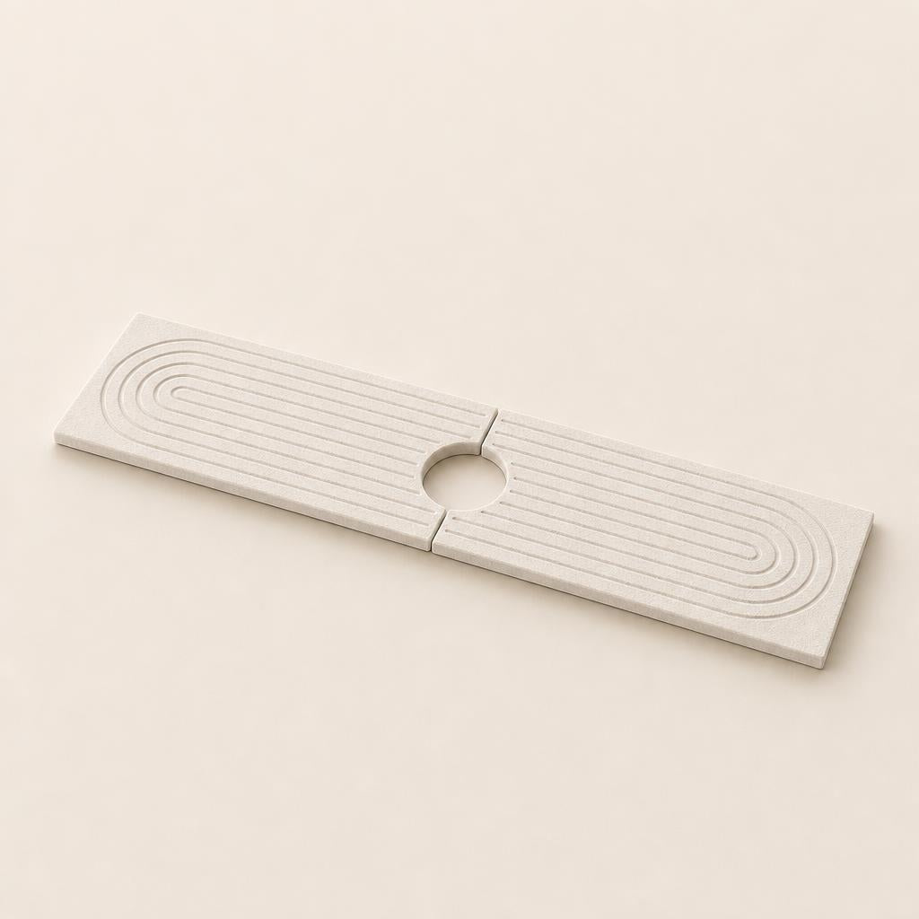 Marbelle diatomite faucet mat, two halves joined with the circular opening for the tap in the middle