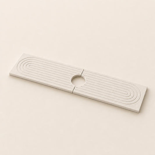 Marbelle diatomite faucet mat, two halves joined with the circular opening for the tap in the middle